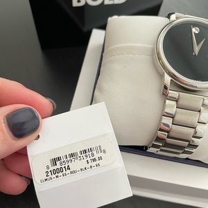 Movado watch - Stainless steel band with black face.